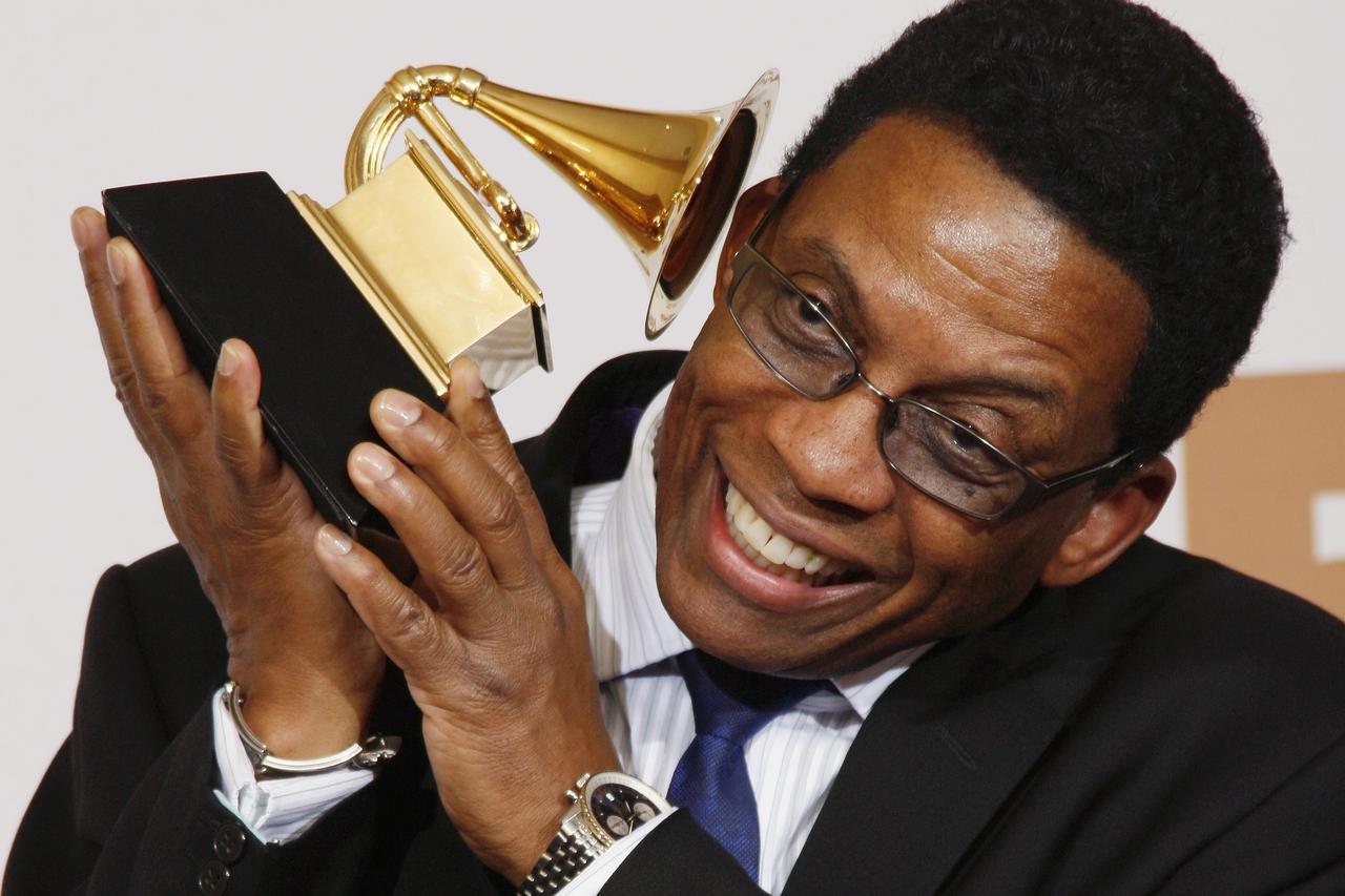 Musician Herbie Hancock poses with his award for Best Contemporary Jazz Album for 
