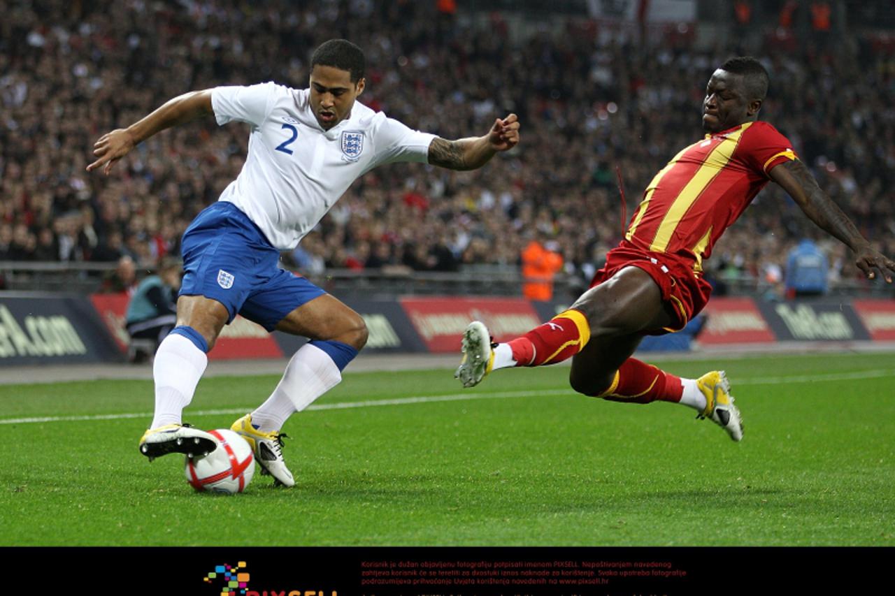 \'England\'s Glen Johnson (left) is challenged by Ghana\'s Lee Addy (right) Photo: Press Association/Pixsell\'