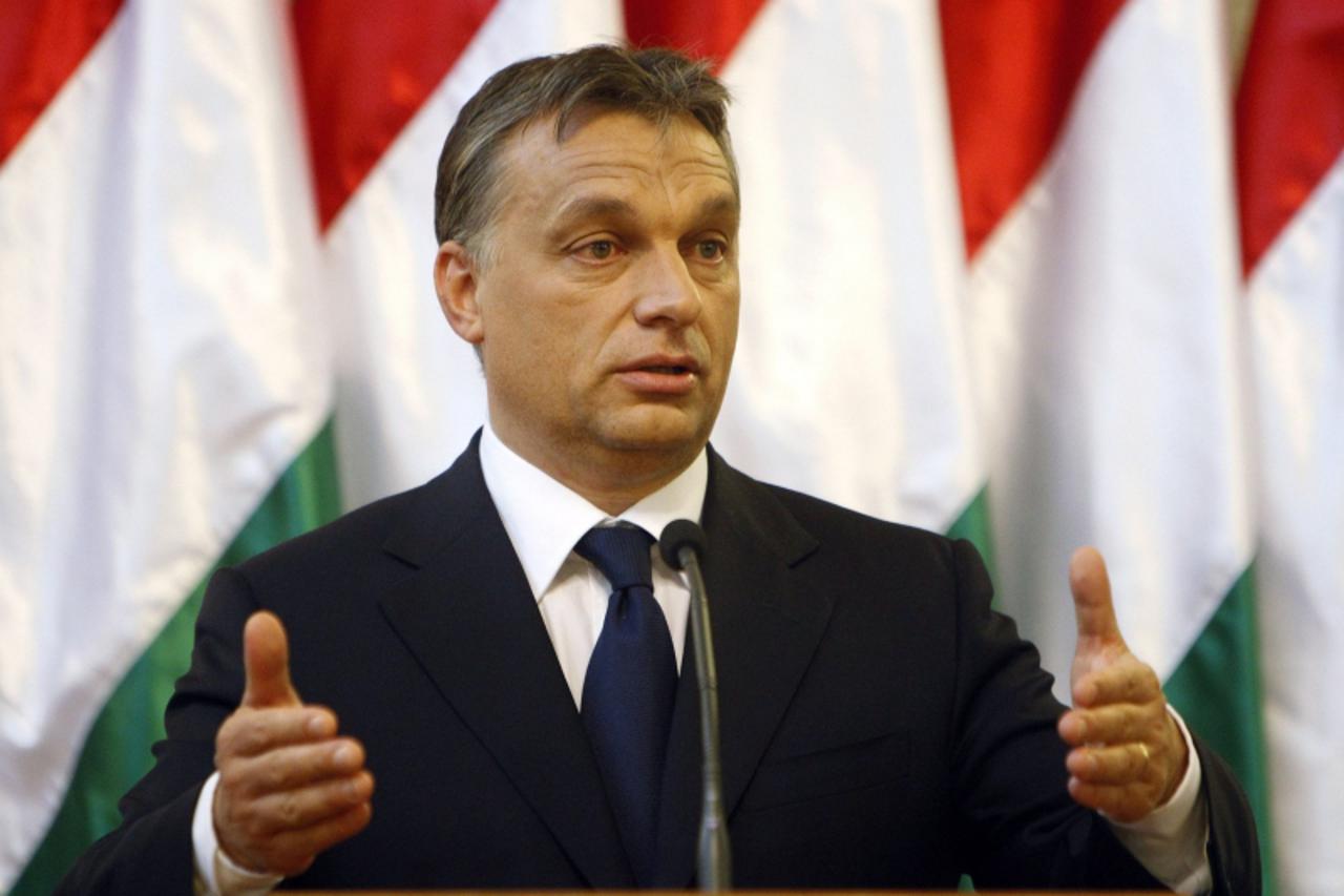 'Hungary\'s Prime Minister Viktor Orban gestures during a joint news conference with Audi Chairman Rupert Stadler in Budapest September 23, 2010. Audi will invest 900 million euros ($1.2 billion) to e