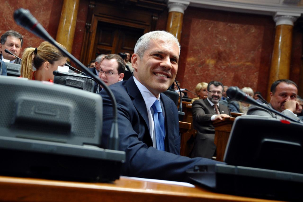 'Serbian President Boris Tadic attends a special session of parliament over the unrest in the mostly ethnic Serb northern Kosovo after Pristina slapped a trade embargo on Serbia, on July 30, 2011. The