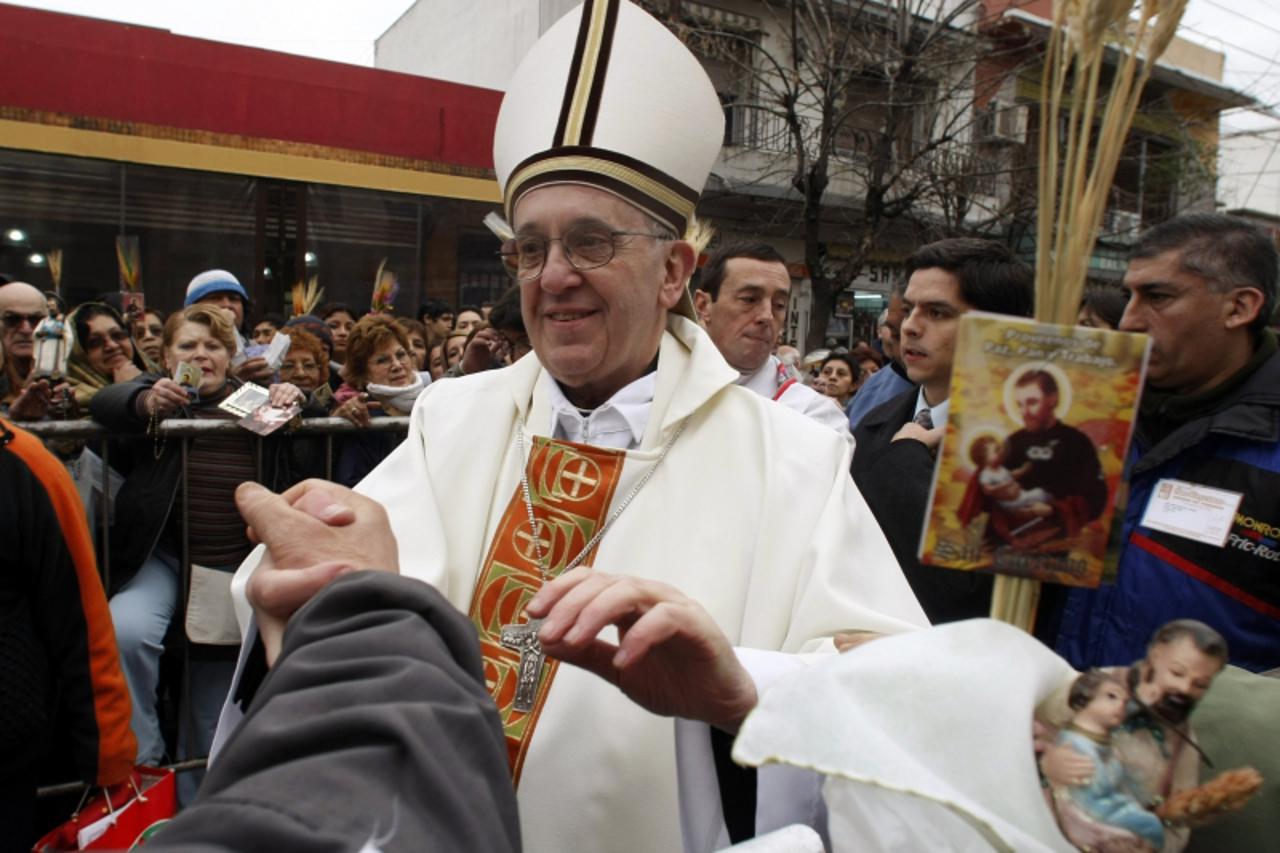 'Archbishop of Buenos Aires Cardinal Jorge Mario Bergoglio greets worshippers, in the Buenos Aires neighbourhood of Liniers, in this August 7, 2009 file photograph. Bergoglio was elected Pope to succe