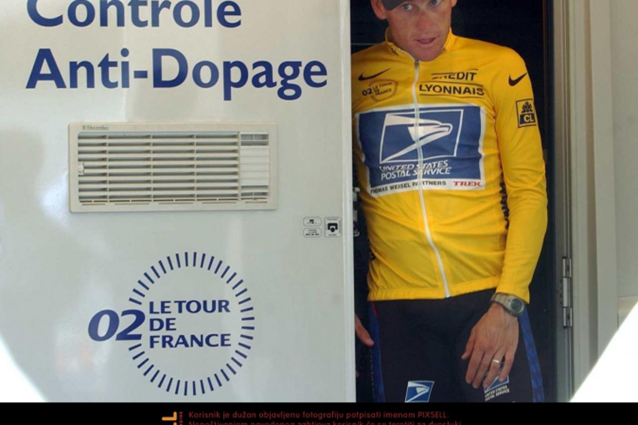 '(dpa) - US Lance Armstrong of the US Postal Service team walks out of the doping control center after the 15th stage of the Tour De France from Vaison-la-Romaine to Les-Deux-Alpes, in Les-Deux-Alpes,