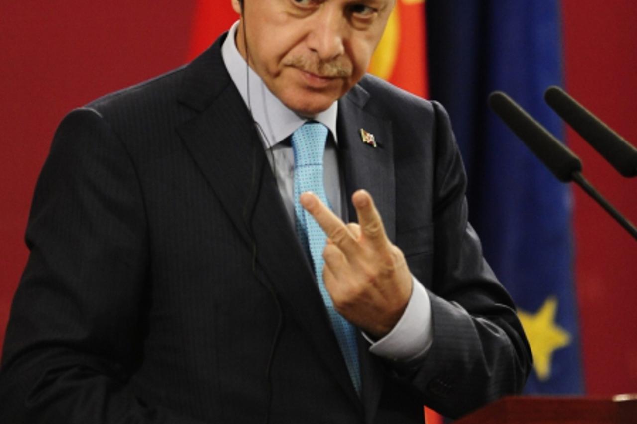 \'Turkey\'s Prime Minister Tayyip Erdogan gestures during a news conference with his Macedonian counterpart Nikola Gruevski in Skopje September 29, 2011. Turkey\'s Prime Minister Erdogan is on a two-d