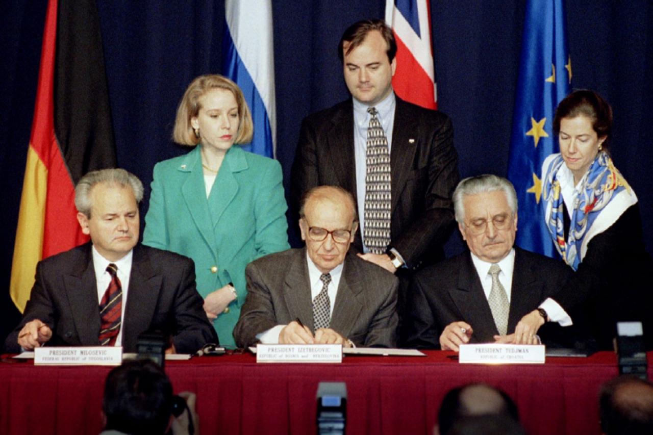 'President Slobodan Milosevic of Serbia (L), President Alija Izetbegovic of Bosnia-Herzegovina (C) and President Franjo Tudjman of Croatia sign the Dayton Agreement peace accord at the Hope Hotel insi