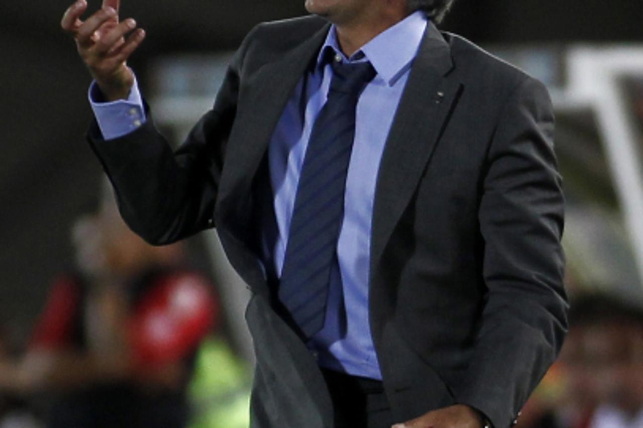 'Real Madrid\'s coach Portuguese Jose Mourinho reacts during the Spanish League football match between Real Madrid and Mallorca at Iberostar Stadium in Palma de Mallorca, on August 29, 2010. Mourinho\