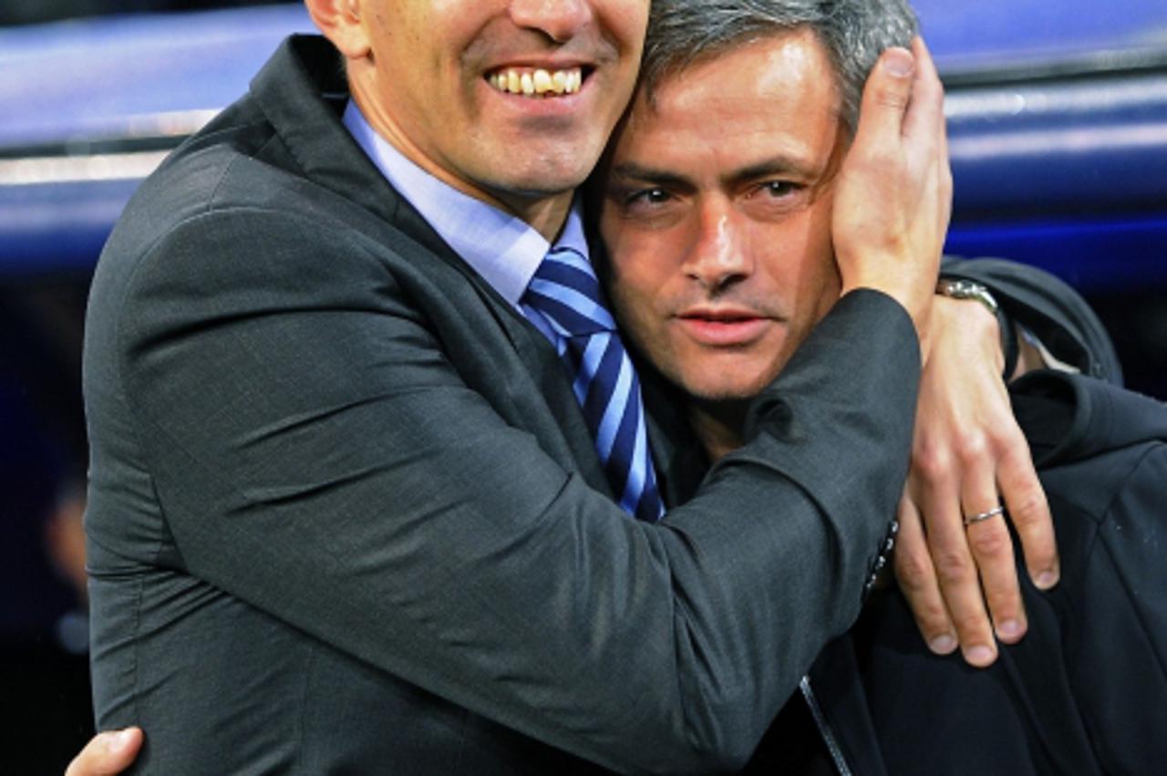 'Dinamo Zagreb\'s coach Krunoslav Jurcic (L) and his Real Madrid counterpart Jose Mourinho embrace before their Champions League Group D soccer match at Santiago Bernabeu stadium in Madrid November 22