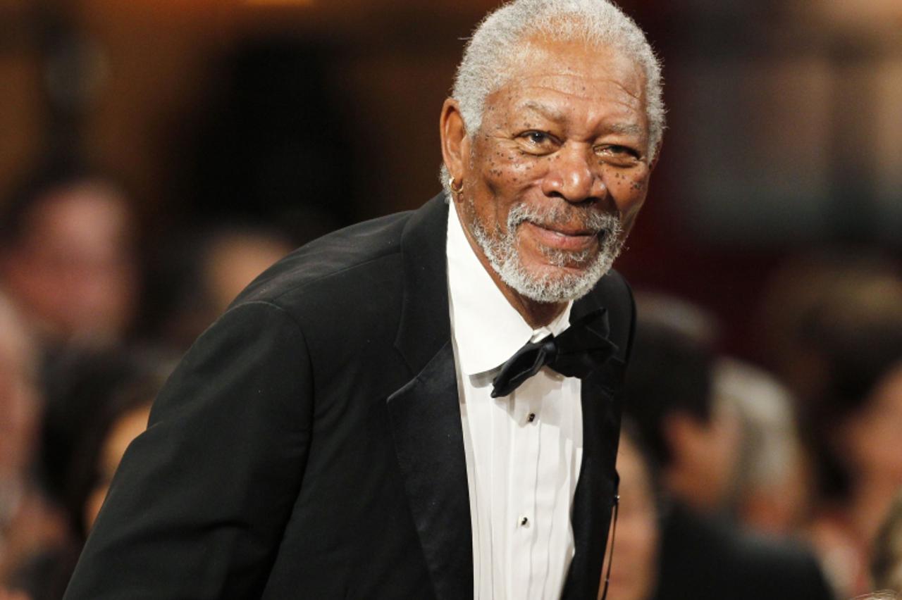 'Actor Morgan Freeman stands as he is introduced at the TV Land cable channel taping of the AFI Life Achievement Award honoring actress Shirley MacLaine in Los Angeles June 7, 2012. The show will be t