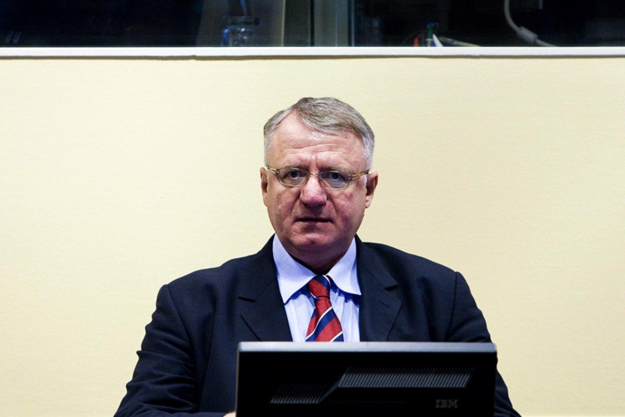 '(FILES) A file photo taken on March 6, 2009 shows Serb ultranationalist leader Vojislav Seselj attending his trial on charges of crimes against humanity at the International Criminal Tribunal for the