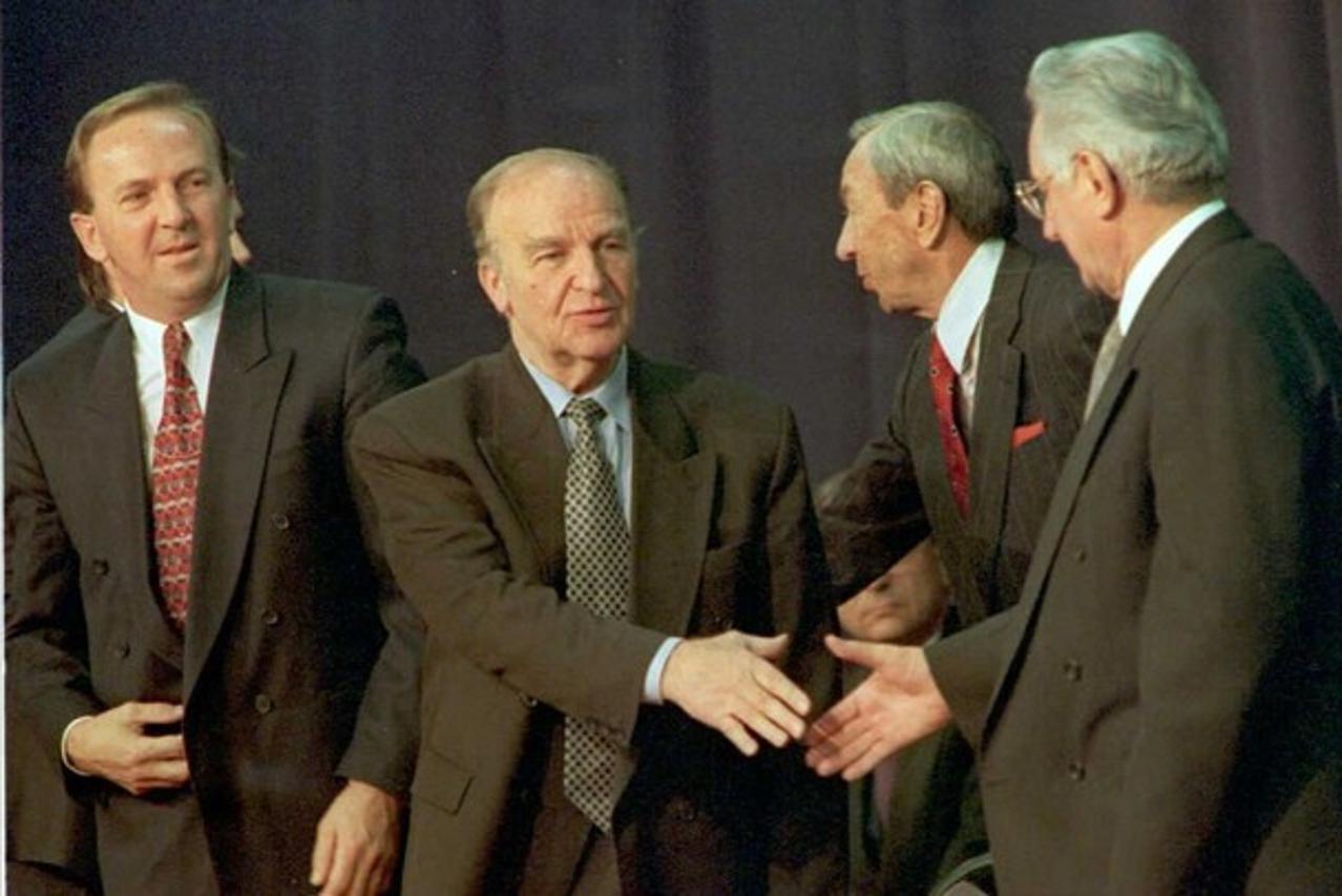 'Federation of Bosnia-Hercegovina President Kresimir Zubak(L) looks on as Bosnian President Alija Izetbegovic(2nd-L) and Republic of Croatia President Franjo Tudjman(R) shake hands 10 November at Wrig