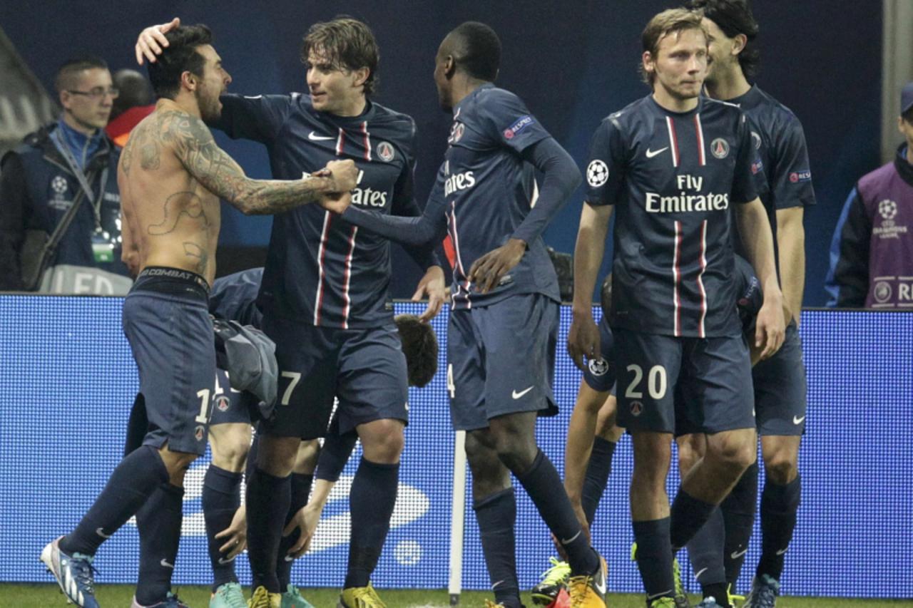 'Paris St Germain's Ezequiel Lavezzi (L) celebrates with team mates after scoring the first goal for the team during their Champions League soccer match against Valencia at the Parc des Princes stadi