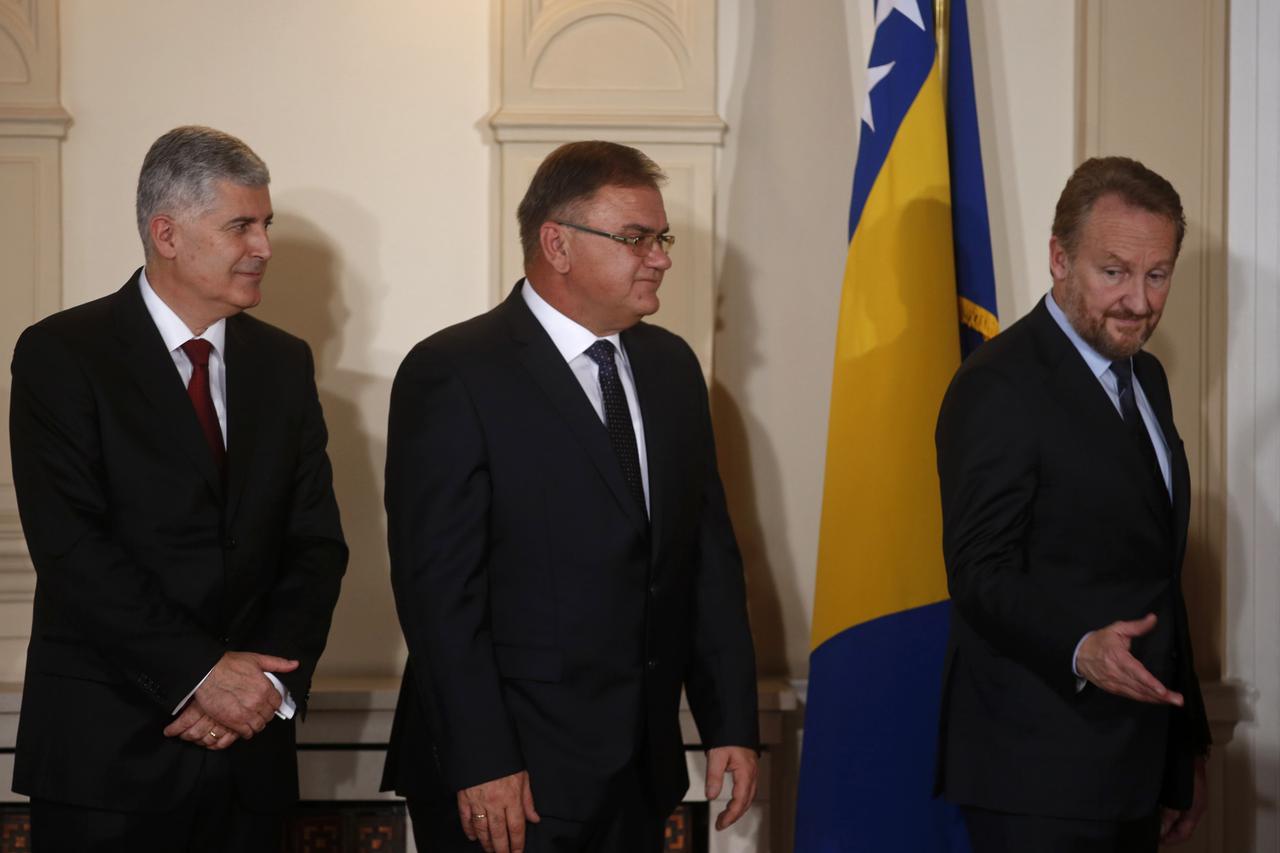 Members of the newly elected Bosnia's tripartite inter-ethnic presidency, from L to R: Croat Dragan Covic, Muslim Mladen Ivanic and Bosniak-Muslim Bakir Izetbegovic, prepare to deliver a joint speech during the presidency inauguration ceremony in Sarajevo