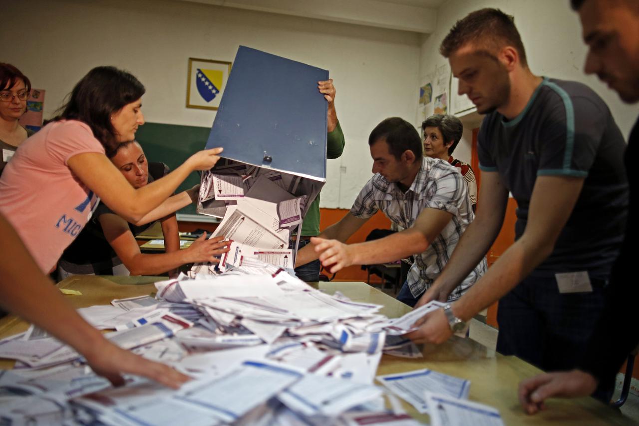 Election Commission officials count votes in the central Bosnian town of Zenica October 12, 2014. Bosnians voted for national, regional and local representatives on Sunday in elections dominated by still-unresolved issues of identity and statehood after a