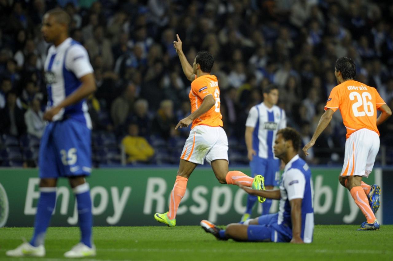 \'Apoel\'s Brazilian forward Ailton (C) celebrates after scoring against FC Porto during their UEFA Champions League, Group G, football match at the Dragao Stadium in Porto on October 19, 2011.  AFP P