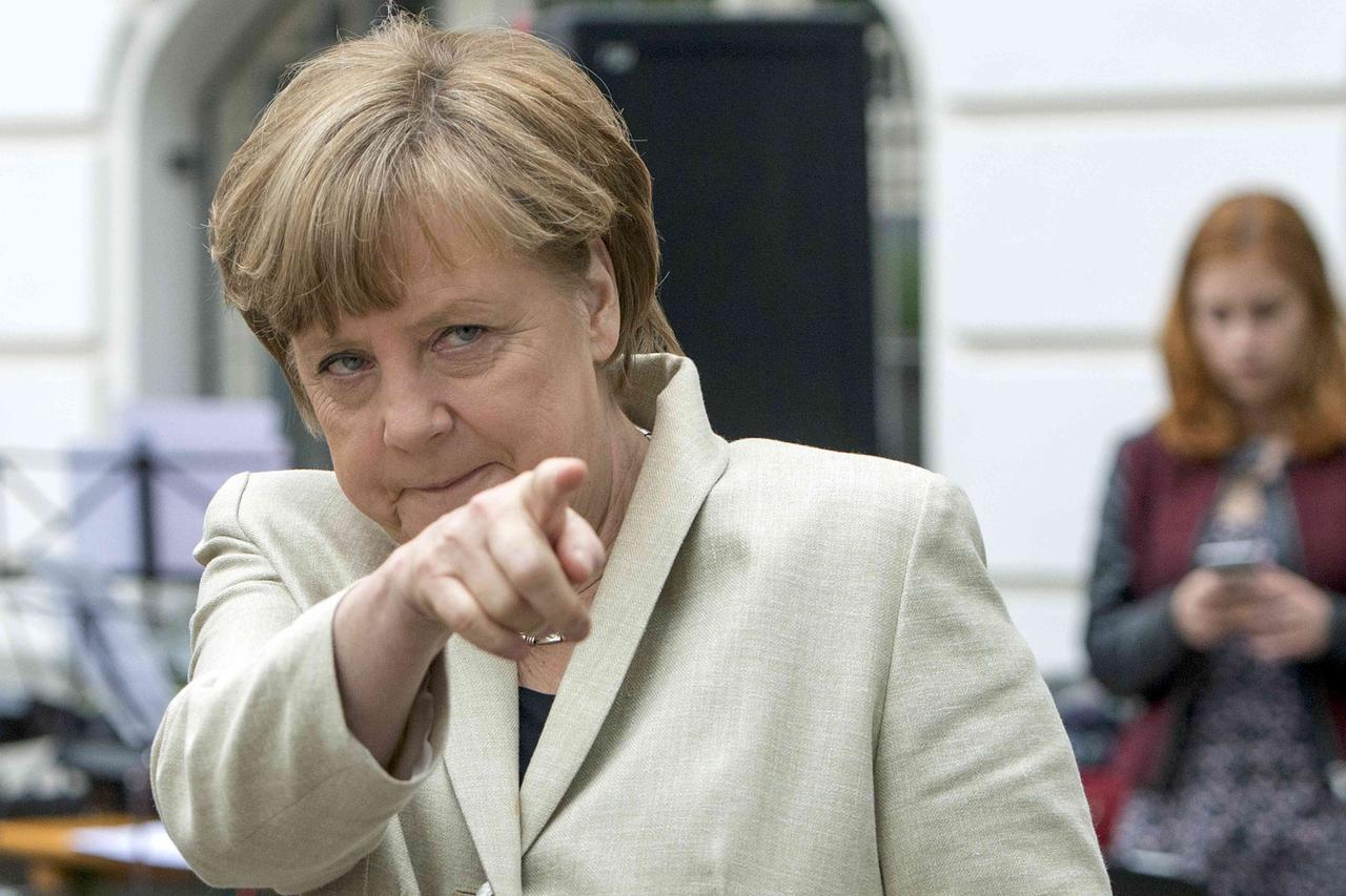 German Chancellor Angela Merkel gestures during her visit to the Roentgen school in Berlin, Germany, May 12, 2015.     REUTERS/Maurizio Gambarini/Pool