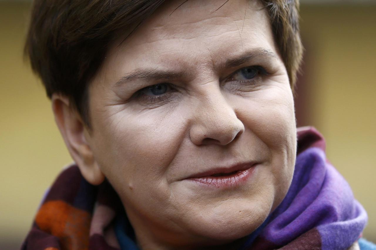 Poland's main opposition party Law and Justice's candidate for prime minister Beata Szydlo looks on sa she leaves a polling station in Przecieszyn, Poland October 25, 2015. Poles vote in an election on Sunday that could end nearly a decade of economic and