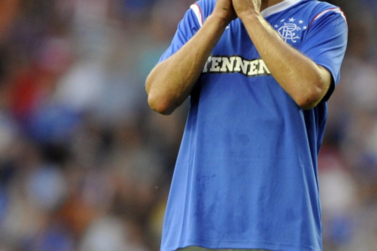 'Rangers\' Nikica Jelavic reacts to a missed opportunity against Malmo FF during their Champions League third qualifying round soccer match at Ibrox Stadium, Glasgow, Scotland, July 26, 2011. REUTERS/