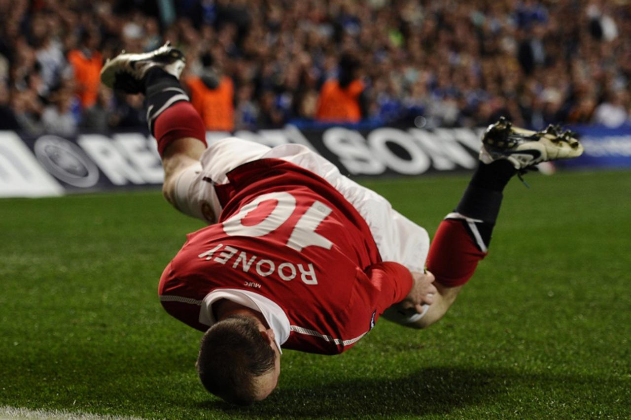 'Manchester United's Wayne Rooney celebrates after scoring a goal during the first leg of their Champions League quarter final soccer match against Chelsea at Stamford Bridge in London April 6, 2011