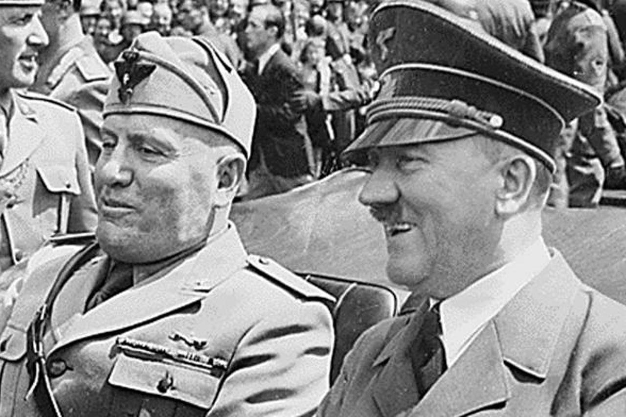\'This file photo taken in June 1940, in Munich, Germany, shows Adolf Hitler (R) riding in a car with Italian Fascist dictator , Benito Mussolini (L) during World War II. AFP PHOTO/HO\'