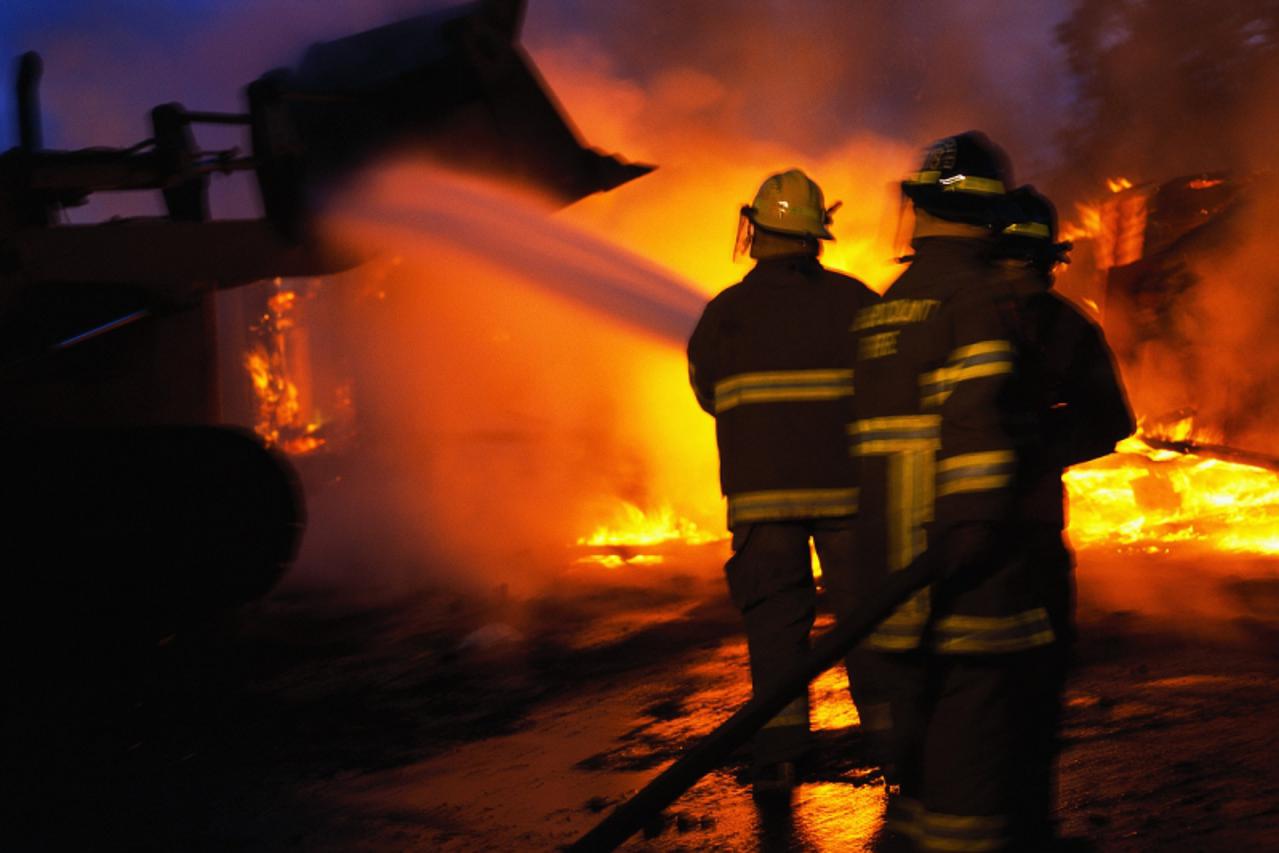 'Firefighters Putting Out a Fire ca. 2001'
